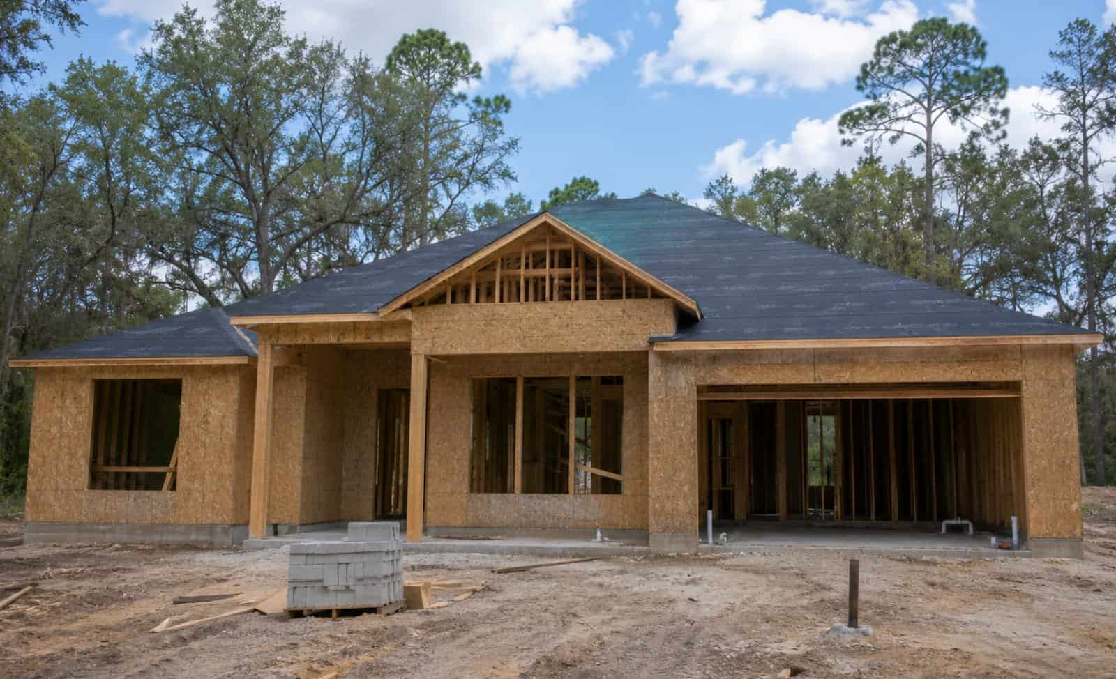 Framed shell of a custom home under construction near Ocala