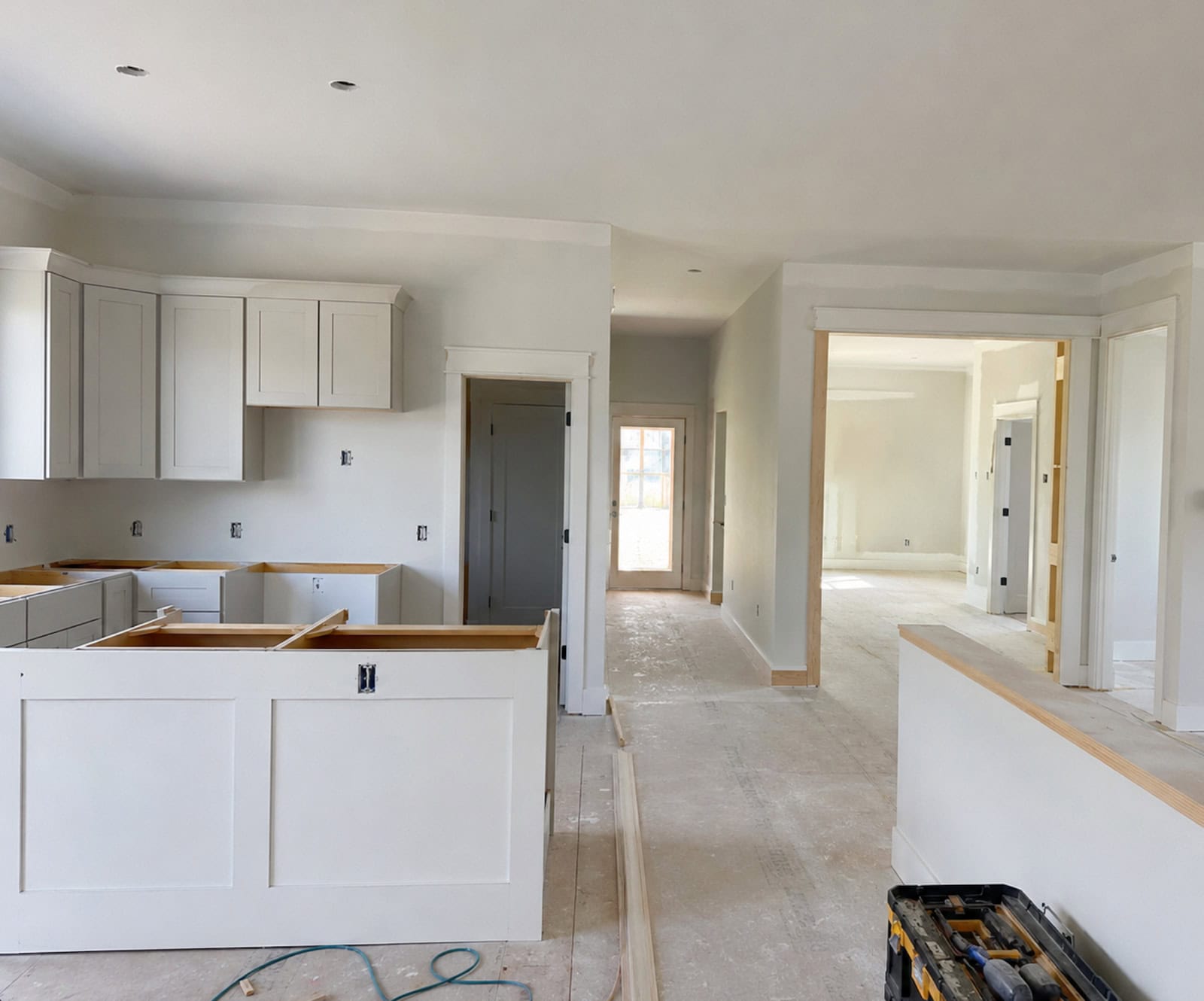 Interior finish work underway on a custom home build