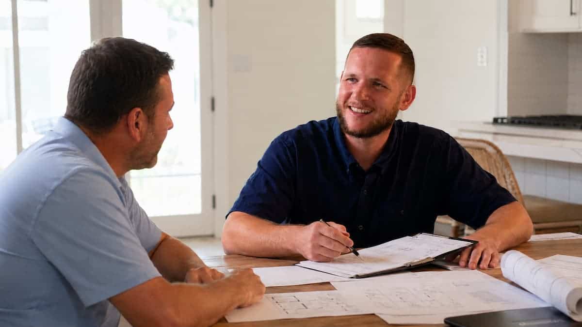 Contractor reviewing VA renovation loan project plans with a Florida homeowner