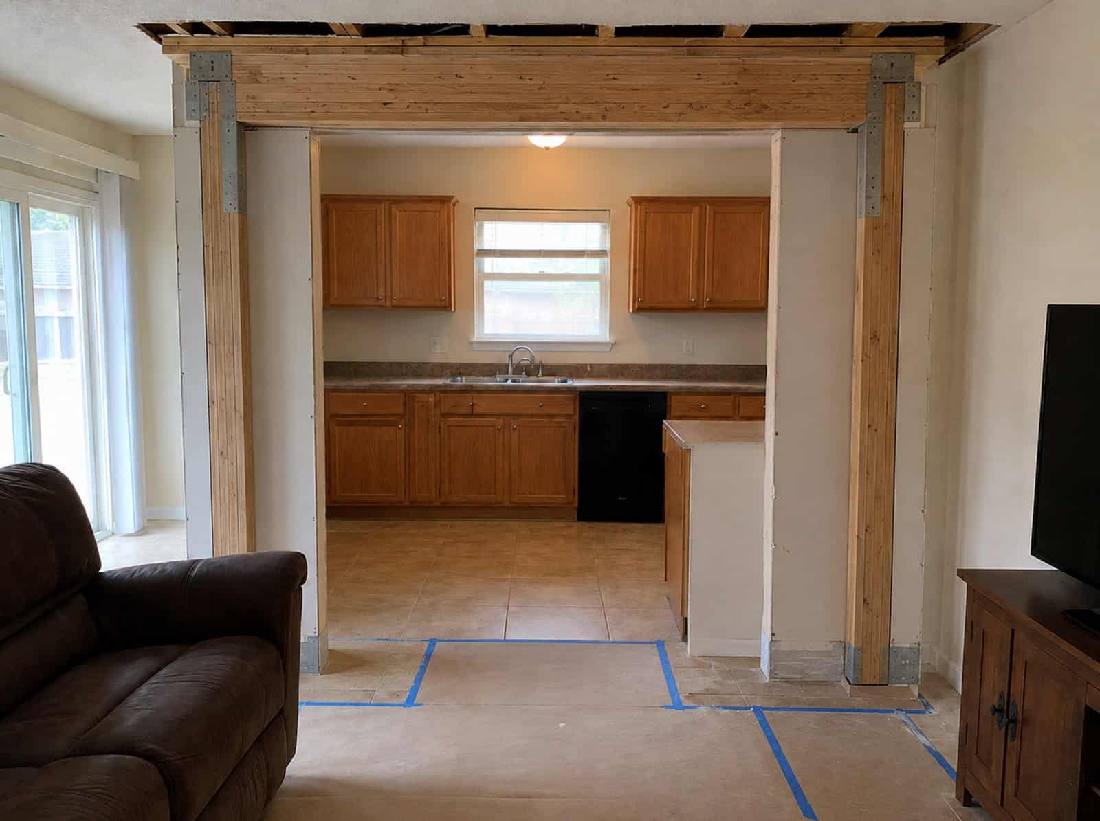 Engineered LVL beam installed during load-bearing wall removal in Ocala, FL